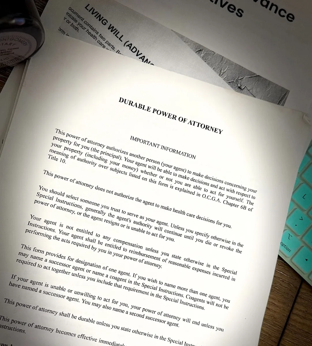 Durable power of attorney and living will documents beside Faith Montgomery’s notary seal